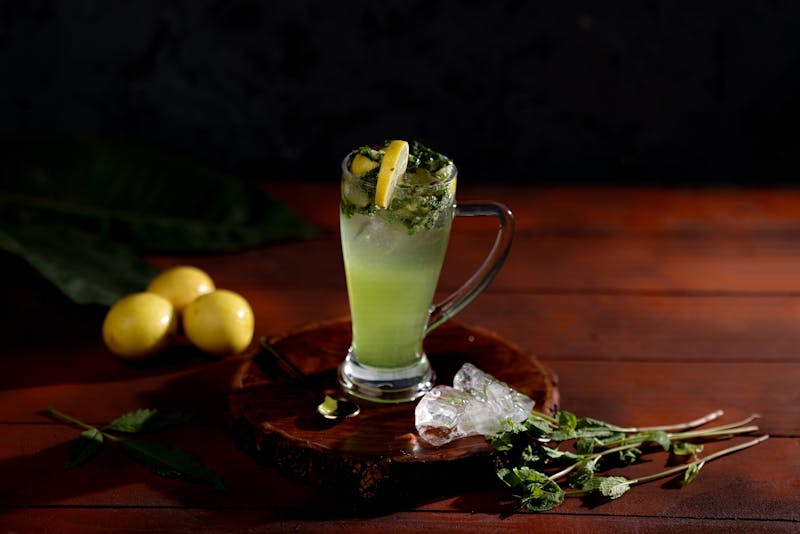 Fresh lemonade with mint and ice served in a tall glass